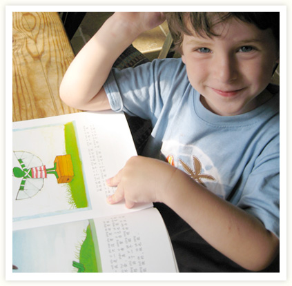 Child reading book.